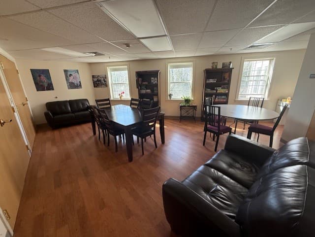 The warm, light-filled community dining room